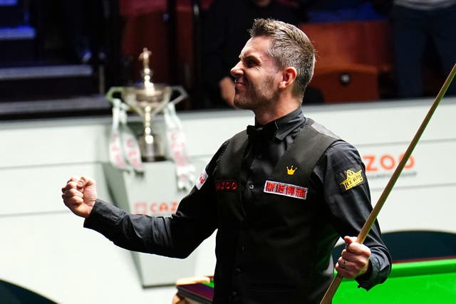 <p>Mark Selby celebrates after completing a maximum break</p>